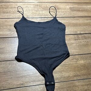 Black Ribbed One-Piece Bodysuit
